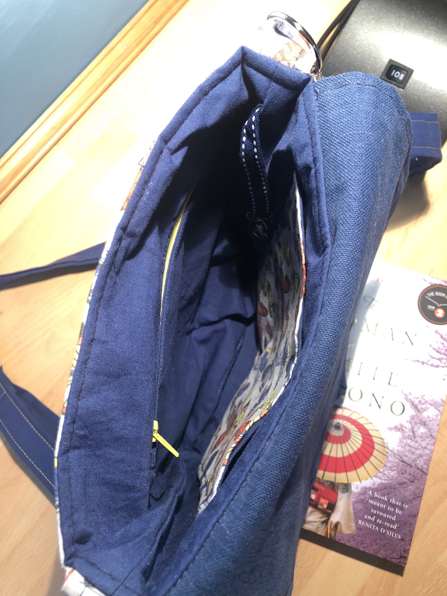 Blue butterfly cross body bag with detachable strap