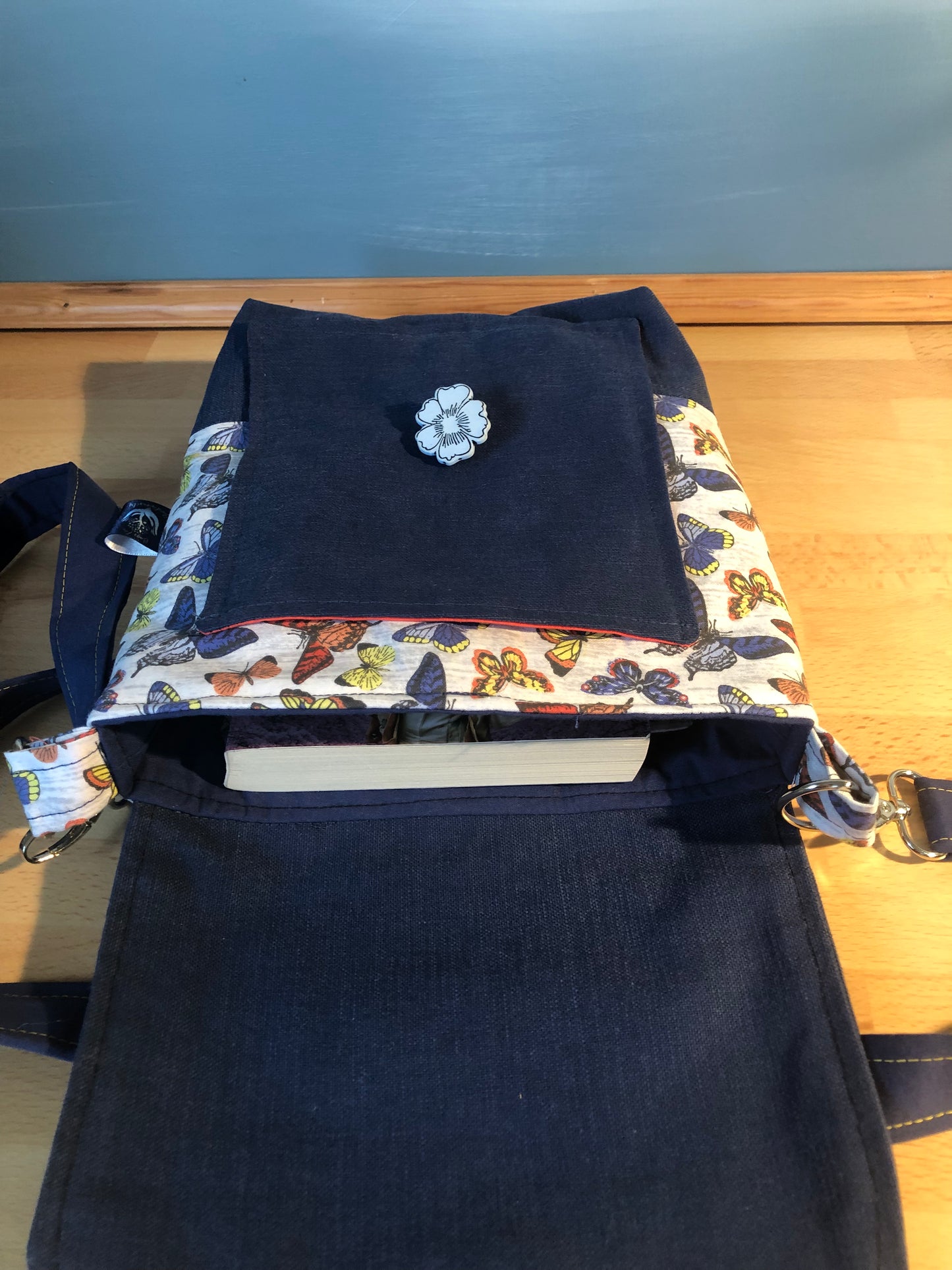 Blue butterfly cross body bag with detachable strap