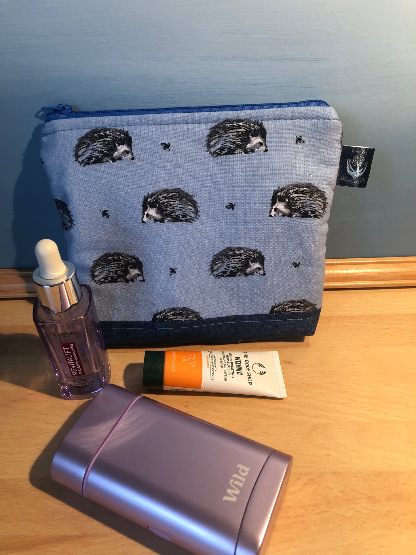 blue hedgehog cosmetic bag with blue zip and waterproof lining