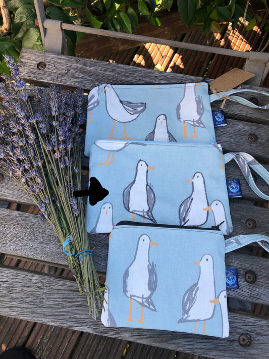 blue grey orange and white seagull patterned cosmetic bag/cable case