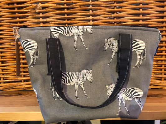 Zebra print washbag with waterproof lining and pockets